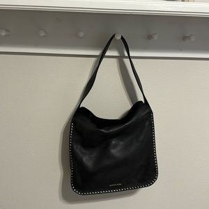 Michael kors black leather purse. NEVER USED. Has a detachable chain strap.